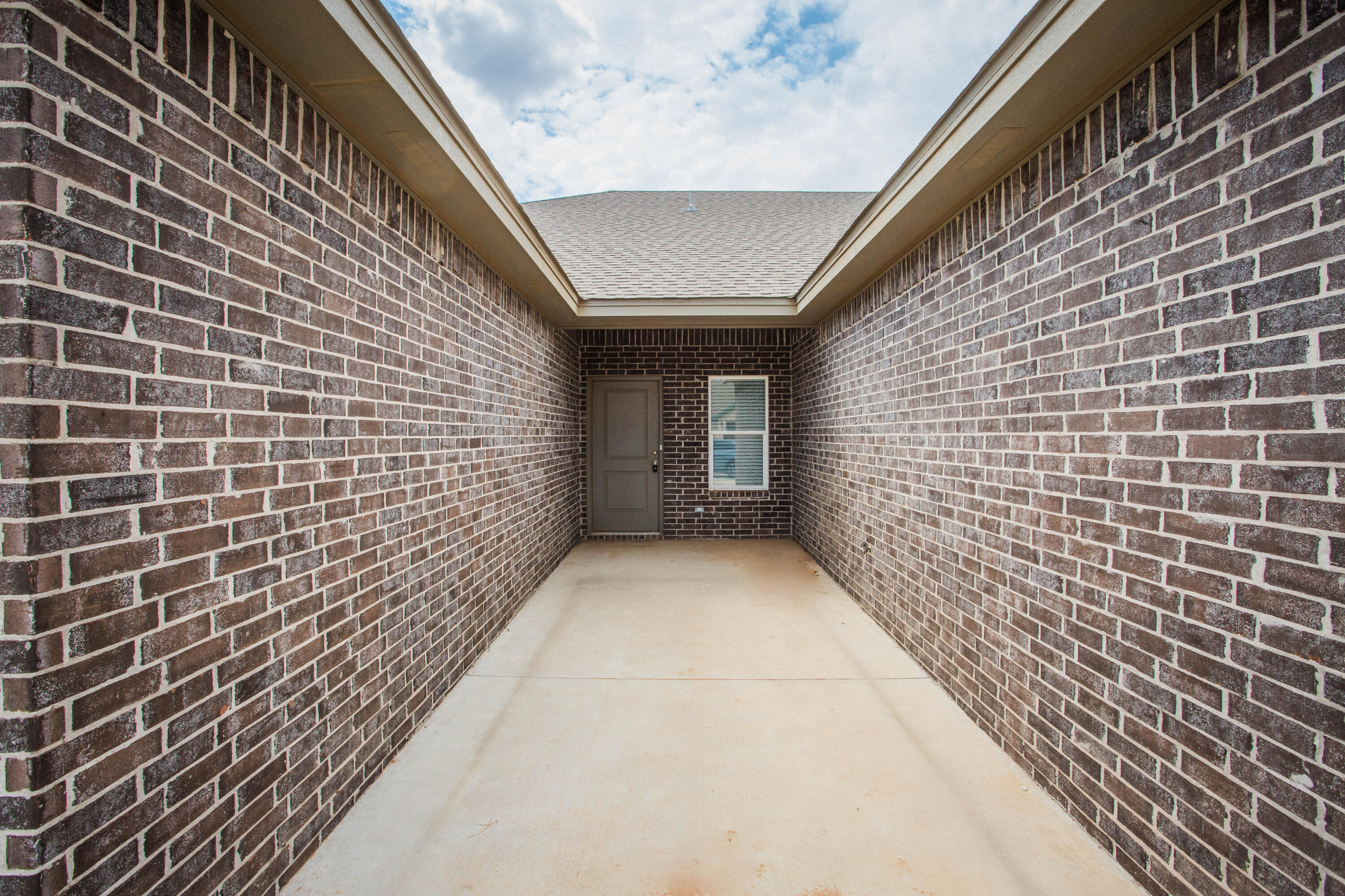 5613 Kemper Street Lubbock, TX 79416 - Photo 30 of 35 a view of a pathway both side of building