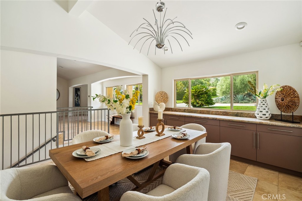 3336 Villa Mesa Road Pasadena, CA 91107 - Photo 13 of 60 a view of a dining room with furniture a rug and wooden floor