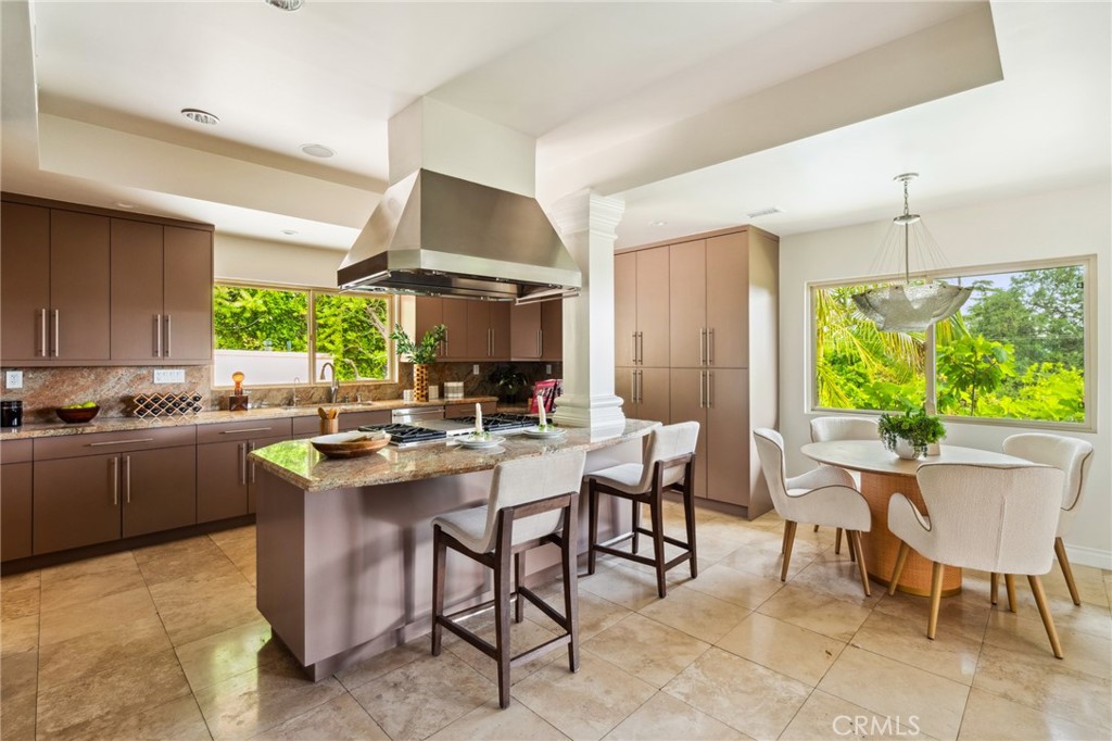 3336 Villa Mesa Road Pasadena, CA 91107 - Photo 14 of 60 a kitchen with a table chairs stove and cabinets
