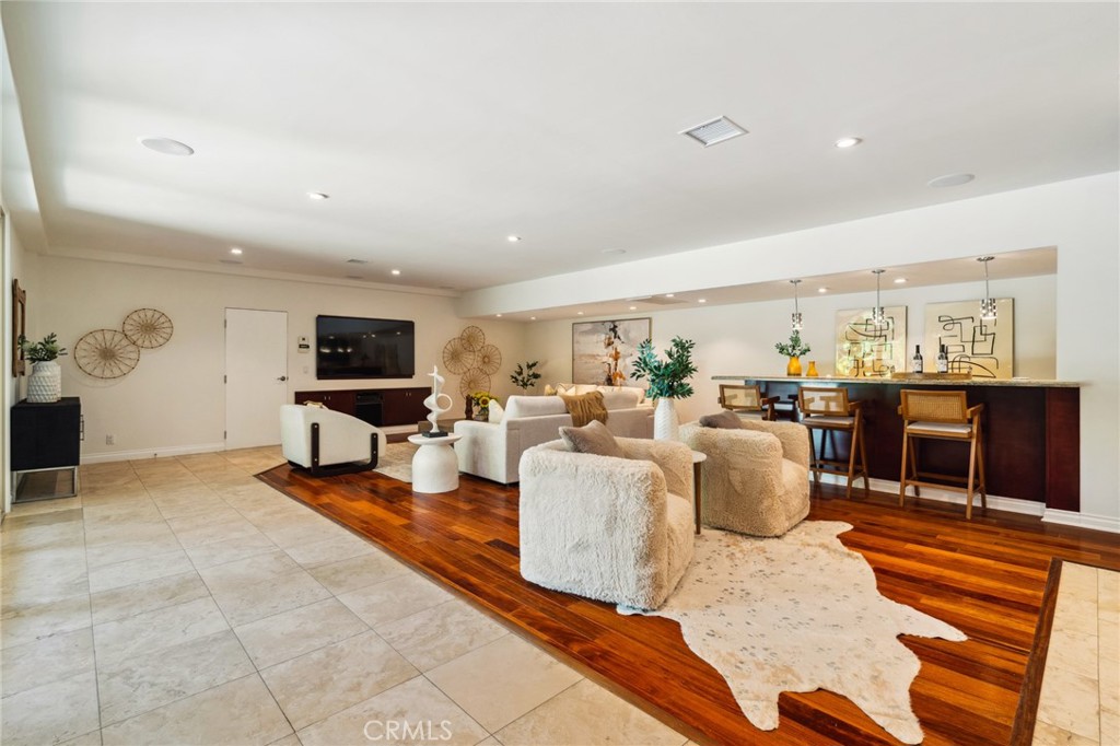3336 Villa Mesa Road Pasadena, CA 91107 - Photo 33 of 60 a living room with furniture a rug and a flat screen tv