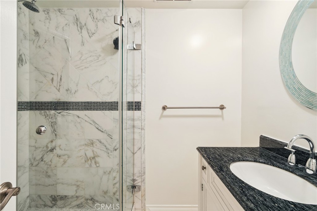 3336 Villa Mesa Road Pasadena, CA 91107 - Photo 38 of 60 a bathroom with a granite countertop shower sink and mirror
