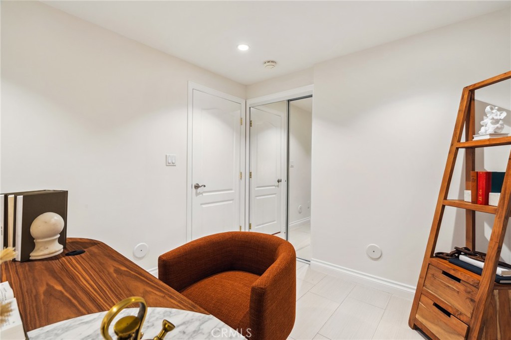 3336 Villa Mesa Road Pasadena, CA 91107 - Photo 40 of 60 a bedroom with furniture and a book shelf