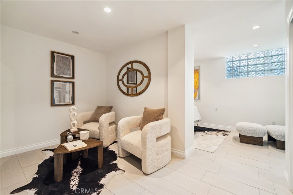 3336 Villa Mesa Road Pasadena, CA 91107 - Photo 41 of 60 a living room with furniture and paintings on the wall