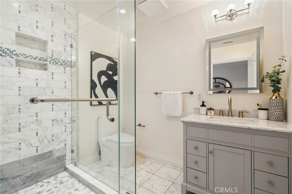 3336 Villa Mesa Road Pasadena, CA 91107 - Photo 42 of 60 a bathroom with a shower sink and mirror