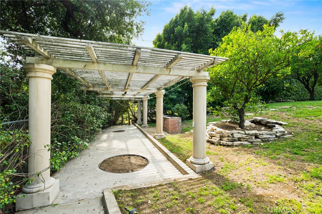 3336 Villa Mesa Road Pasadena, CA 91107 - Photo 58 of 60 a view of a patio with table and chairs potted plants with wooden fence