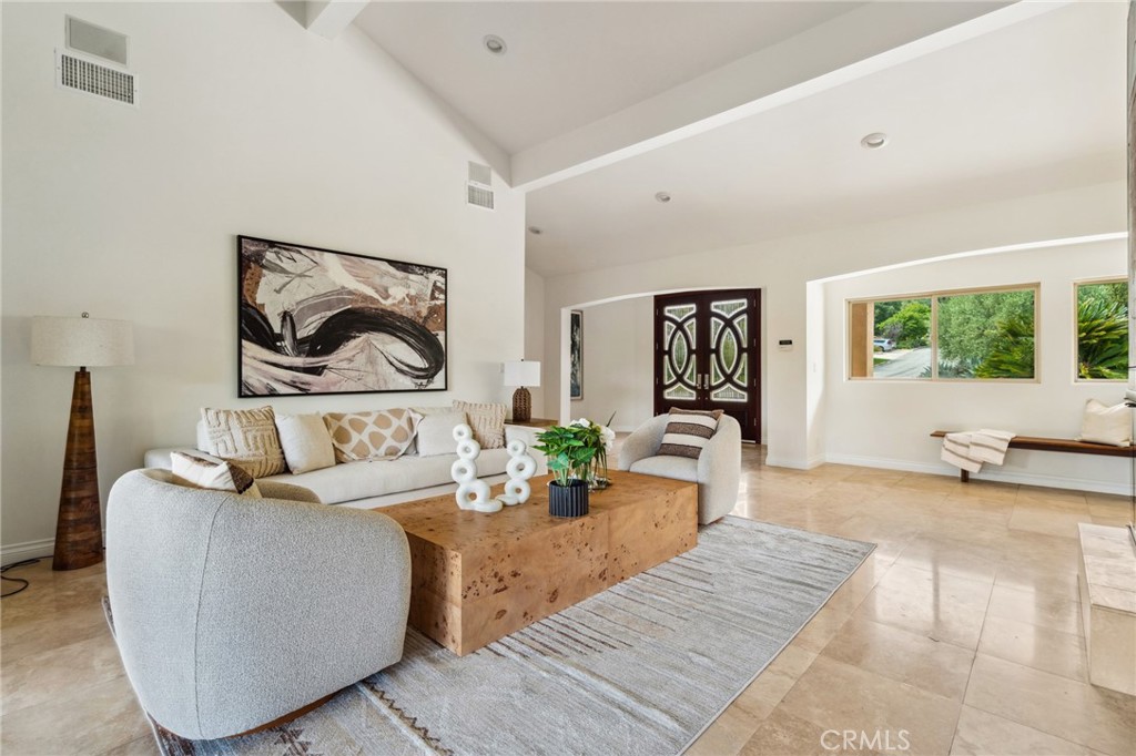 3336 Villa Mesa Road Pasadena, CA 91107 - Photo 7 of 60 a living room with furniture and painting on the wall next to a window