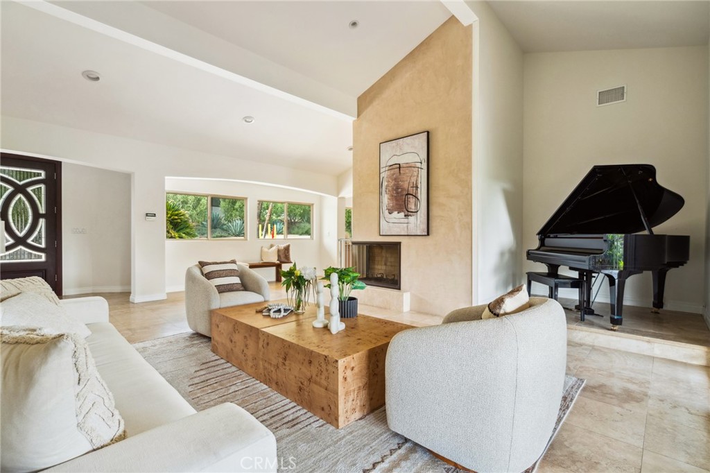 3336 Villa Mesa Road Pasadena, CA 91107 - Photo 9 of 60 a living room with furniture and a lamp