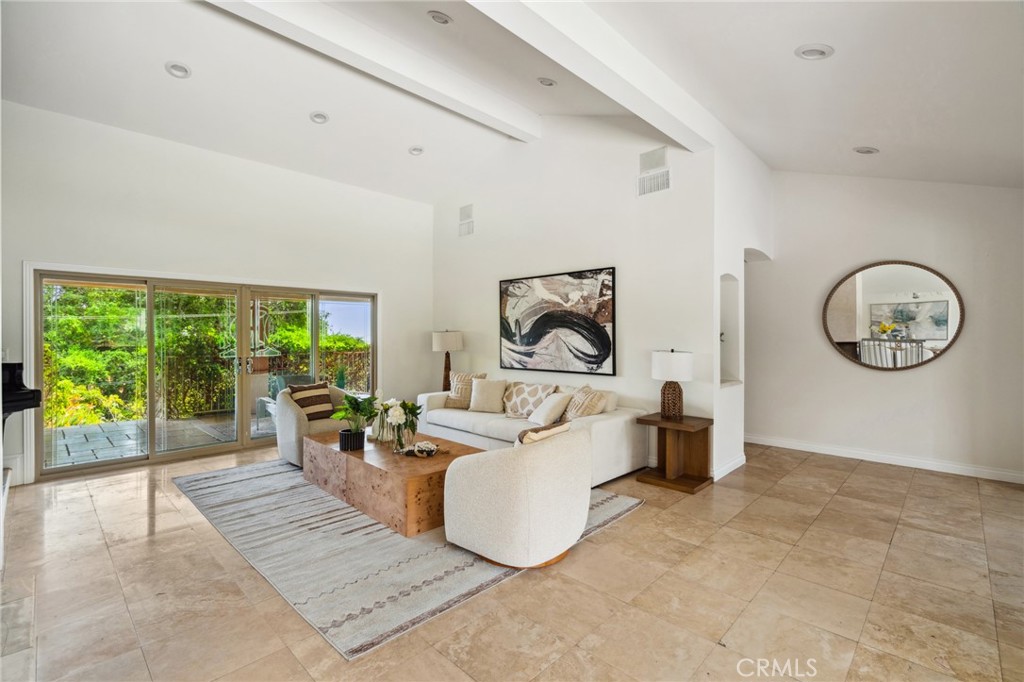 3336 Villa Mesa Road Pasadena, CA 91107 - Photo 10 of 60 a living room with furniture a large window and a chandelier