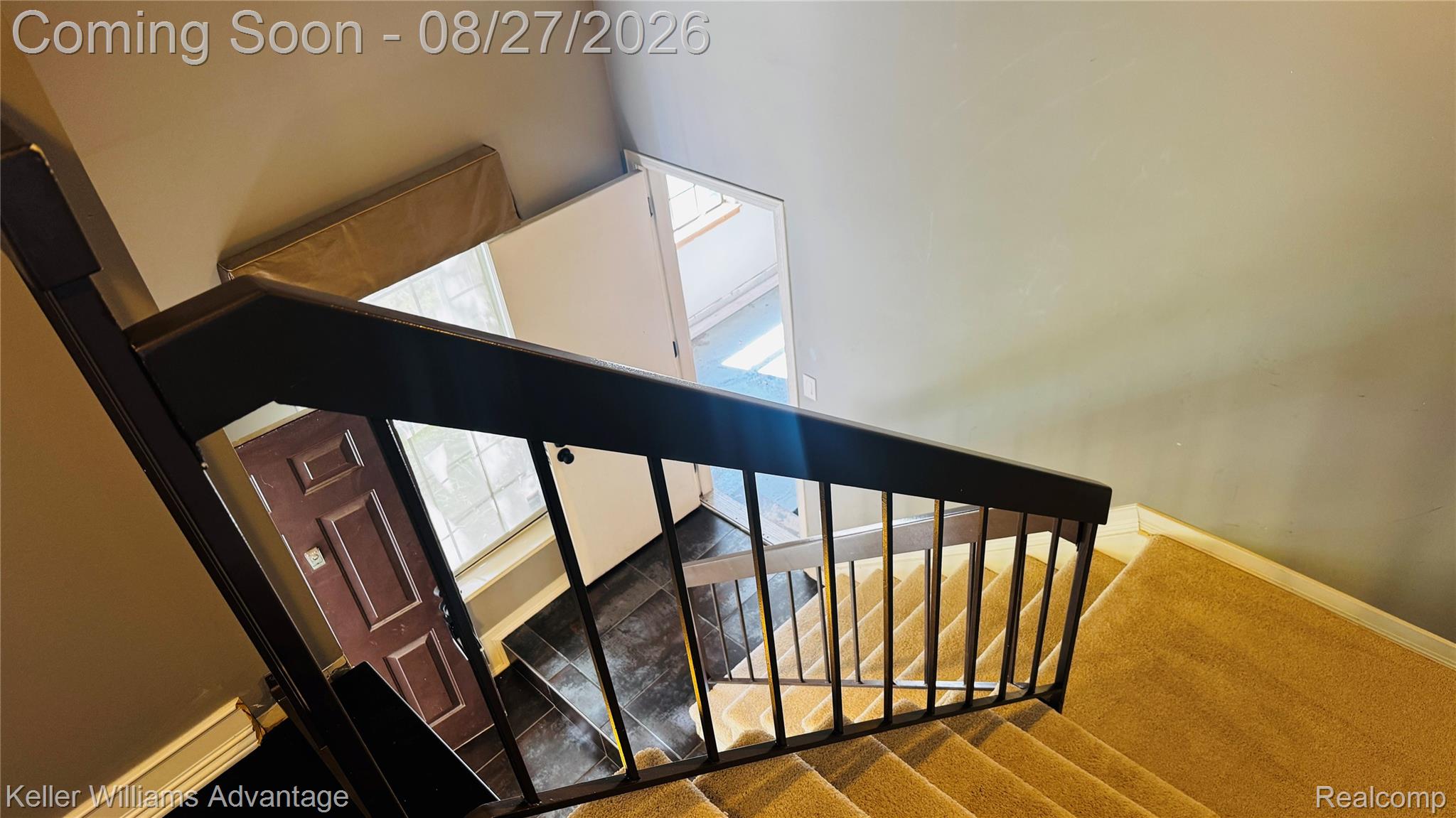 29726 Pine Ridge Circle Farmington, MI 48331 - Photo 39 of 42 Carpeted staircase with dark wood-finish handrail and black metal balusters