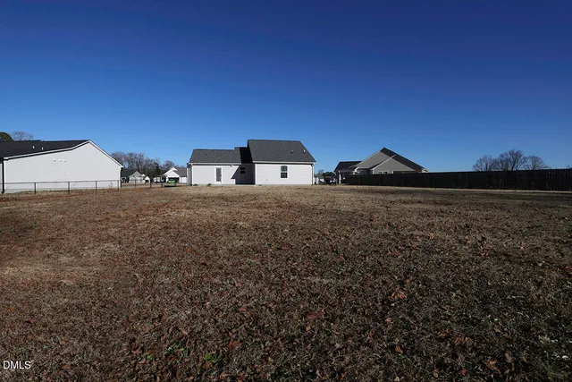 a view of a backyard of the house