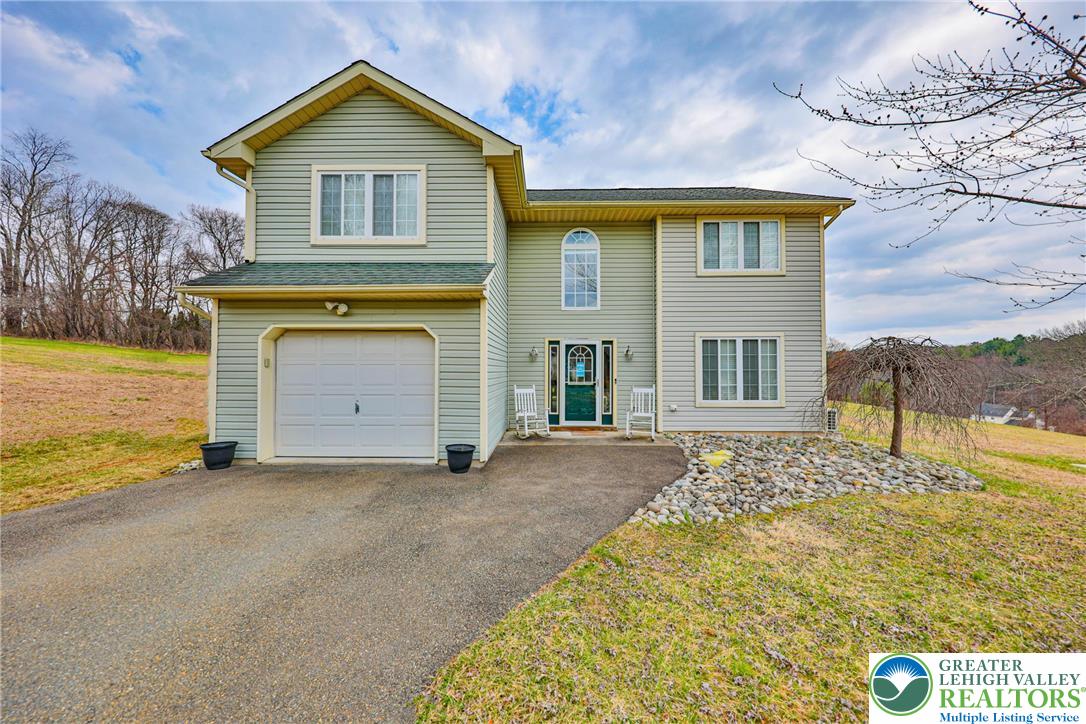 2260 Reo Drive Effort, PA 18330 - Photo 1 of 40 a front view of a house with a yard
