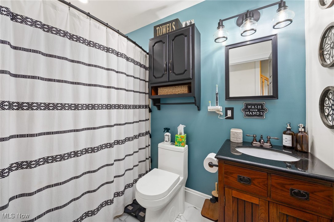 11827 Stratton Road West Salem, OH 44287 - Photo 30 of 47 Full bath featuring vanity and a shower with curtain