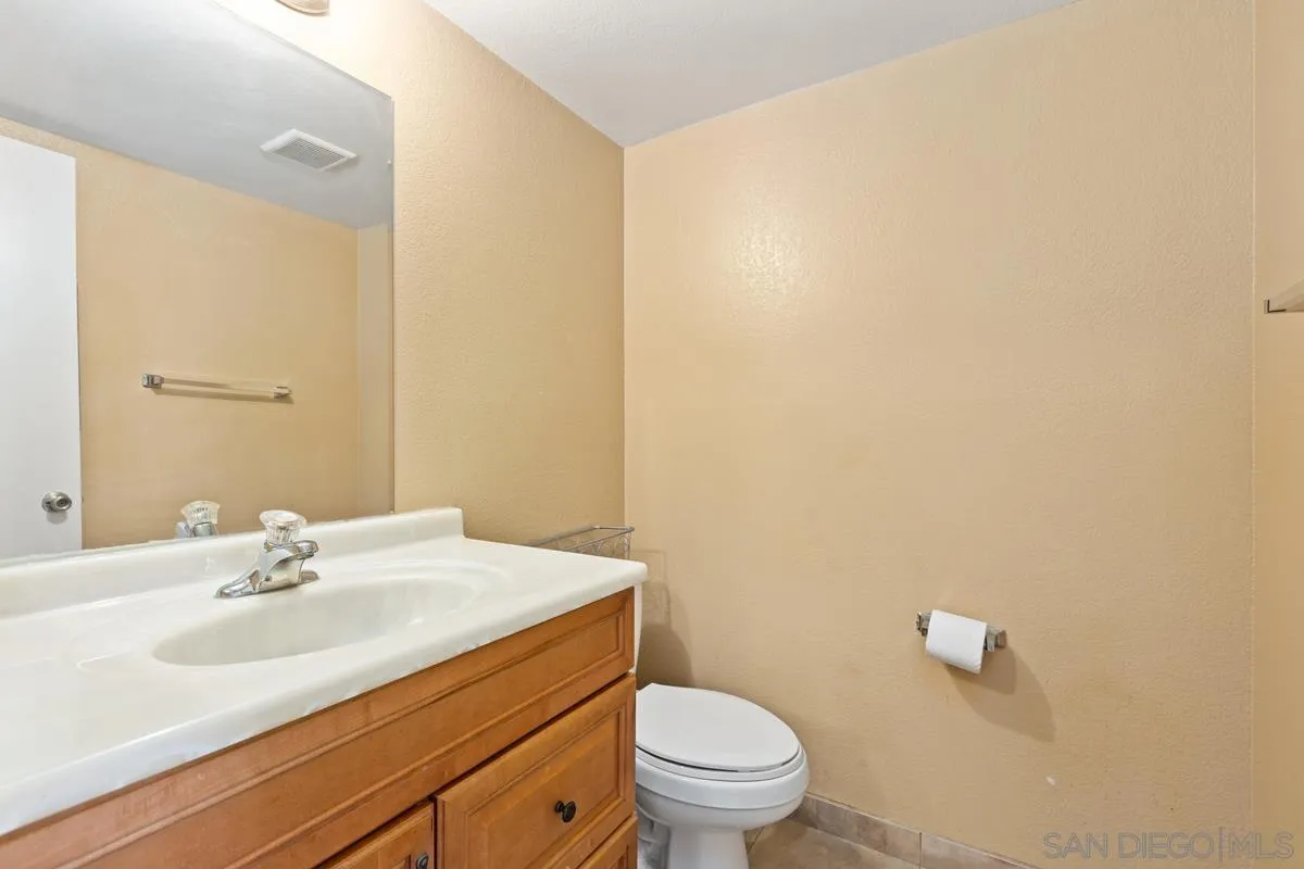 12027 Royal Road, Unit 3 El Cajon, CA 92021 - Photo 19 of 20 a bathroom with a sink and a toilet