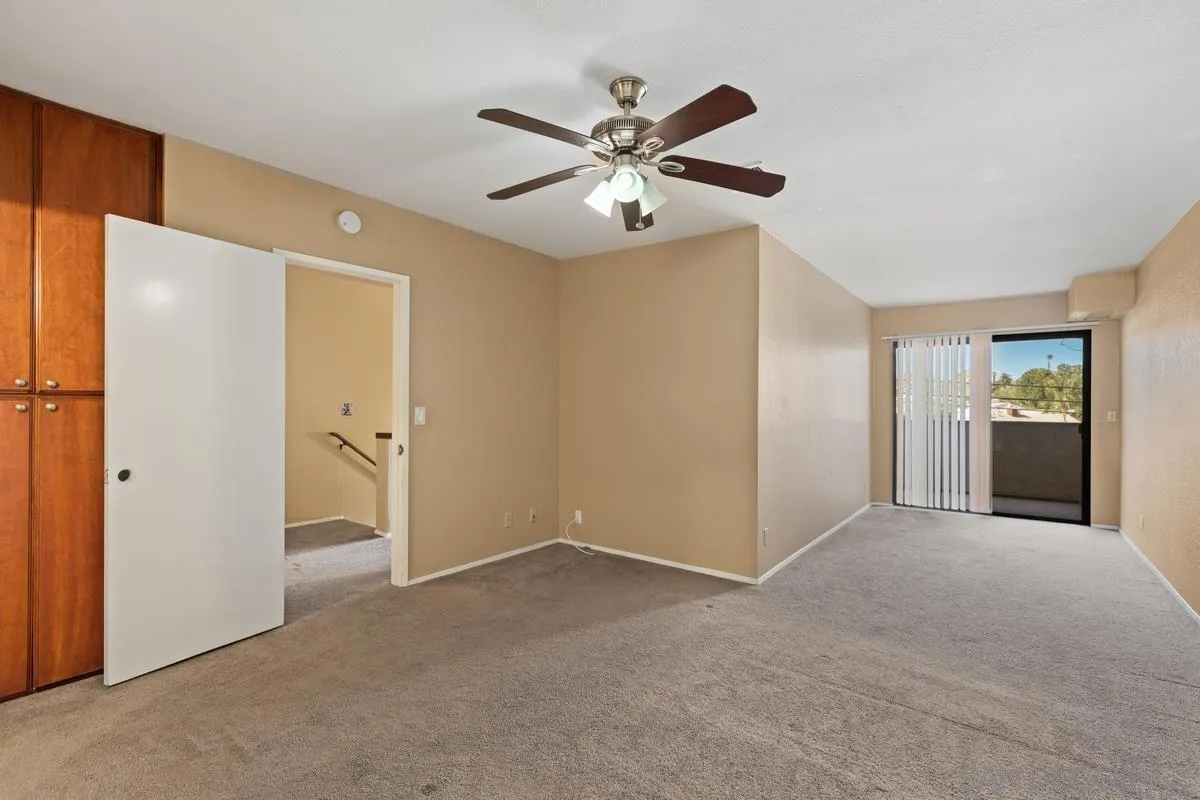 12027 Royal Road, Unit 3 El Cajon, CA 92021 - Photo 9 of 20 a view of a livingroom with a ceiling fan & entryway