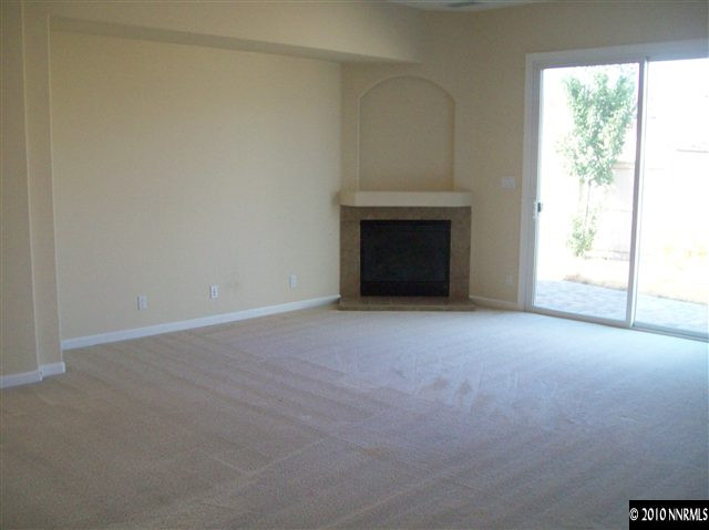 2115 Huntsdale Drive Reno, NV 89521 - Photo 4 of 7 a view of empty room with a fireplace