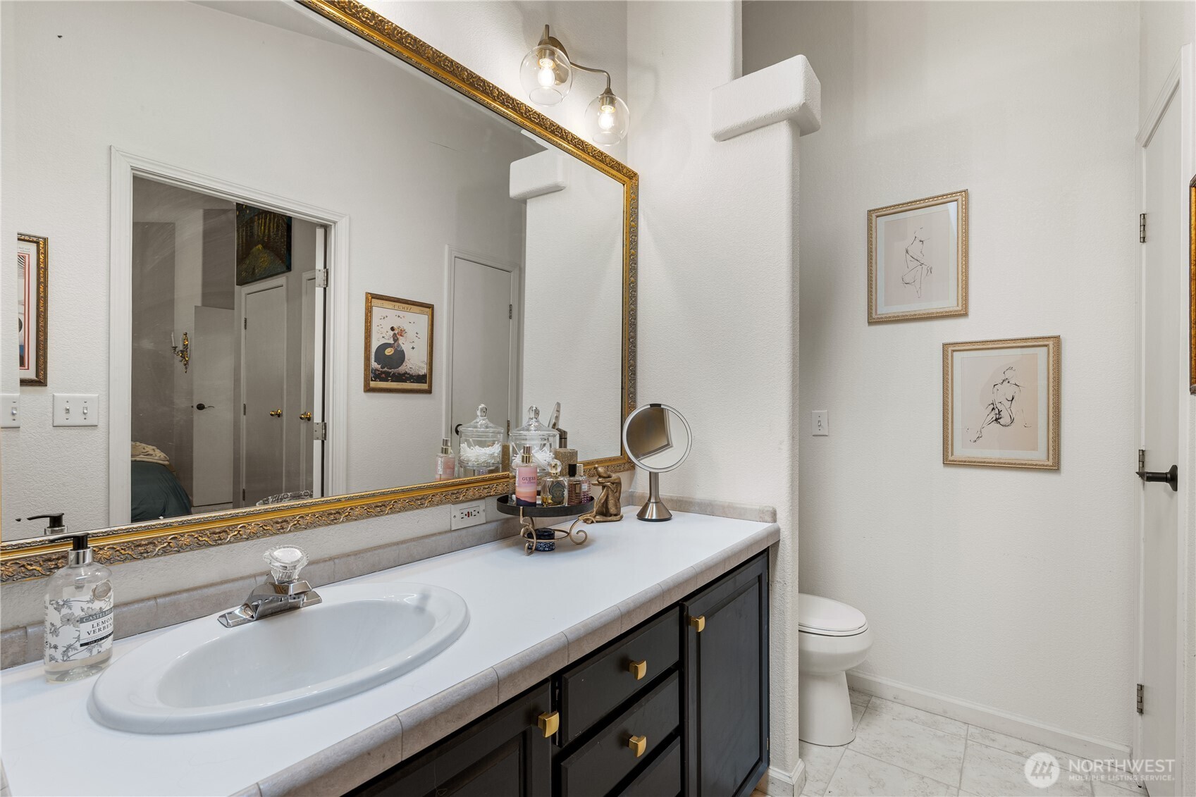 23825 15th Avenue Southeast, Unit 40 Bothell, WA 98021 - Photo 20 of 39 a bathroom with a sink a toilet and mirror
