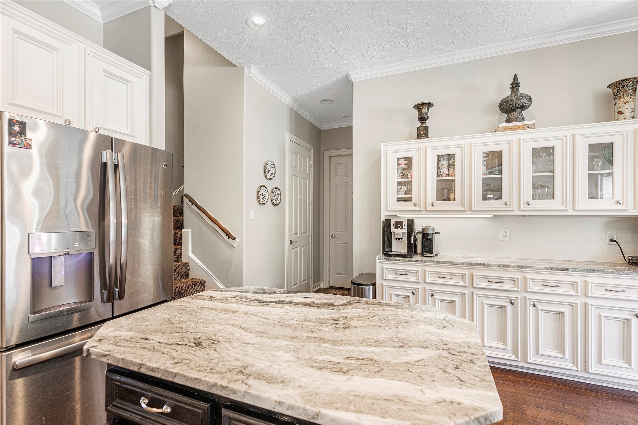 6530 Treaschwig Road, Unit 1 Spring, TX 77373 - Photo 9 of 32 a kitchen with stainless steel appliances granite countertop a refrigerator oven a sink dishwasher and white cabinets next to a window