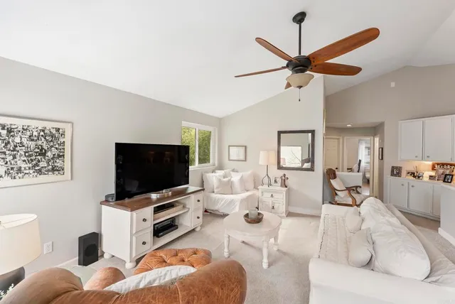 a view of a patio with a couch and a fire pit