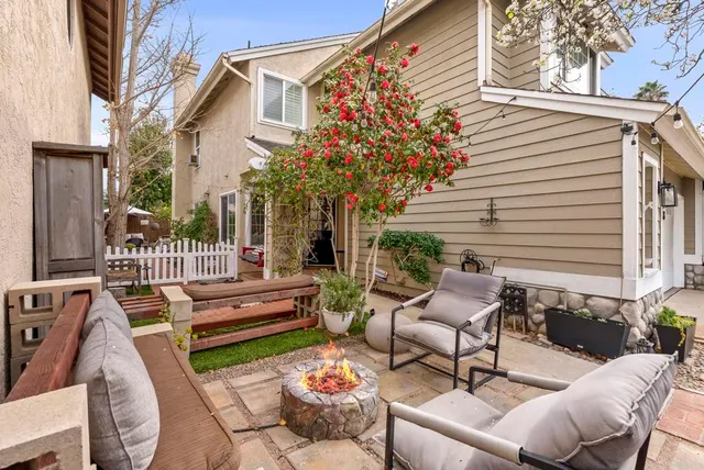 a dining room with furniture window and wooden floor