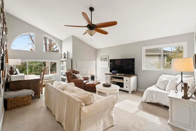 a room with furniture and a wooden deck