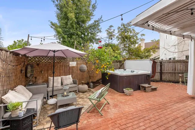 an aerial view of residential houses with outdoor space