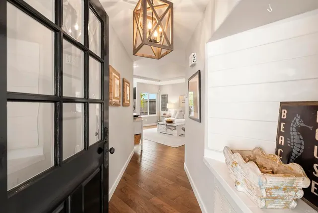 a living room with fireplace furniture and a flat screen tv