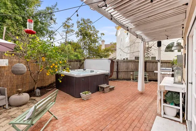 an aerial view of a house with a mountain