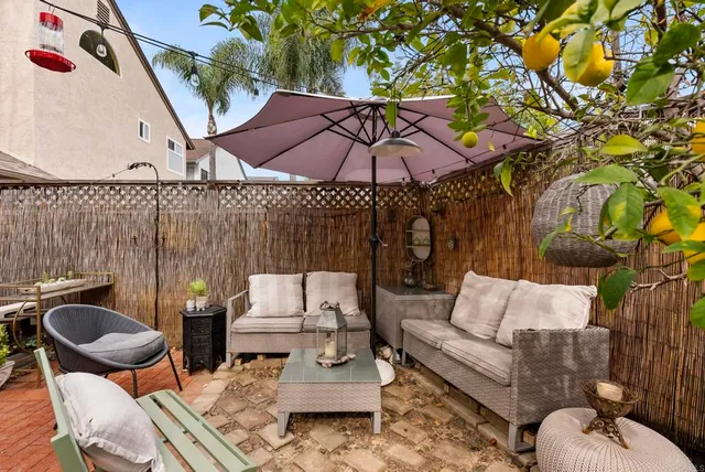 a view of a garden with a building in the background