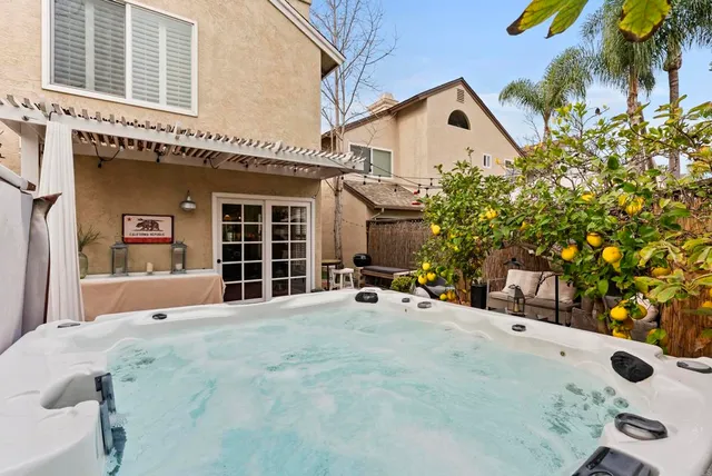 a view of a swimming pool with outdoor seating