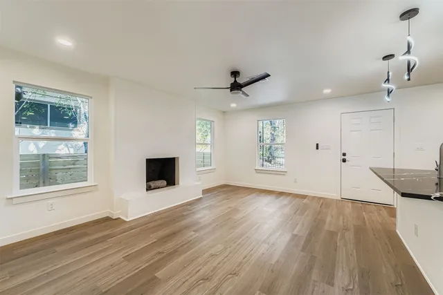 a view of kitchen with stainless steel appliances kitchen island a sink and a refrigerator