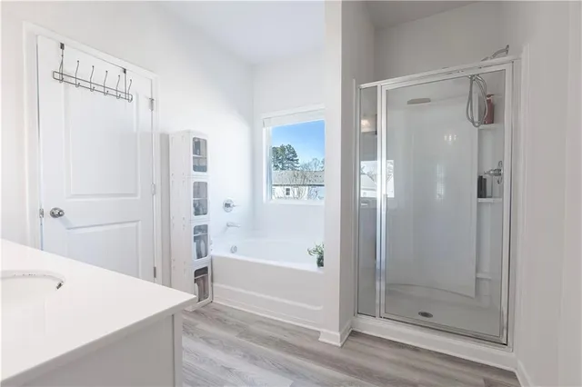 a bathroom with a bathtub and a shower