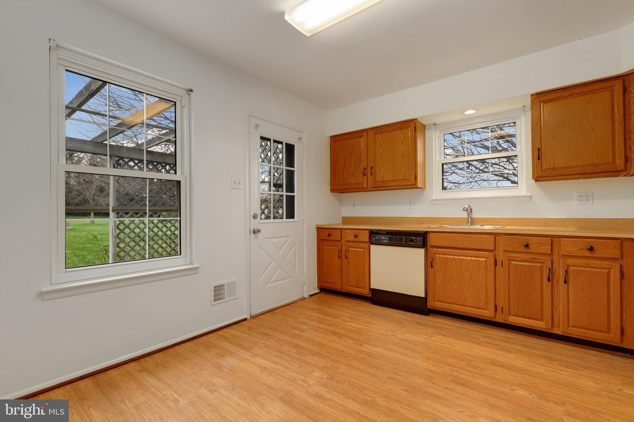 5652 Sandy Court Frederick, MD 21703 - Photo 11 of 35 a kitchen with stainless steel appliances granite countertop a stove a sink and a microwave