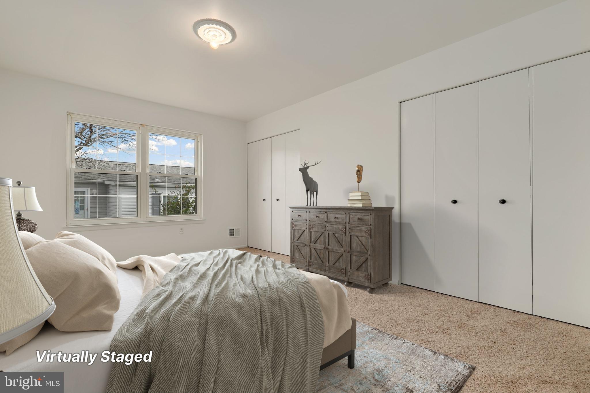 5652 Sandy Court Frederick, MD 21703 - Photo 14 of 35 a bed sitting in a spacious bedroom next to a window