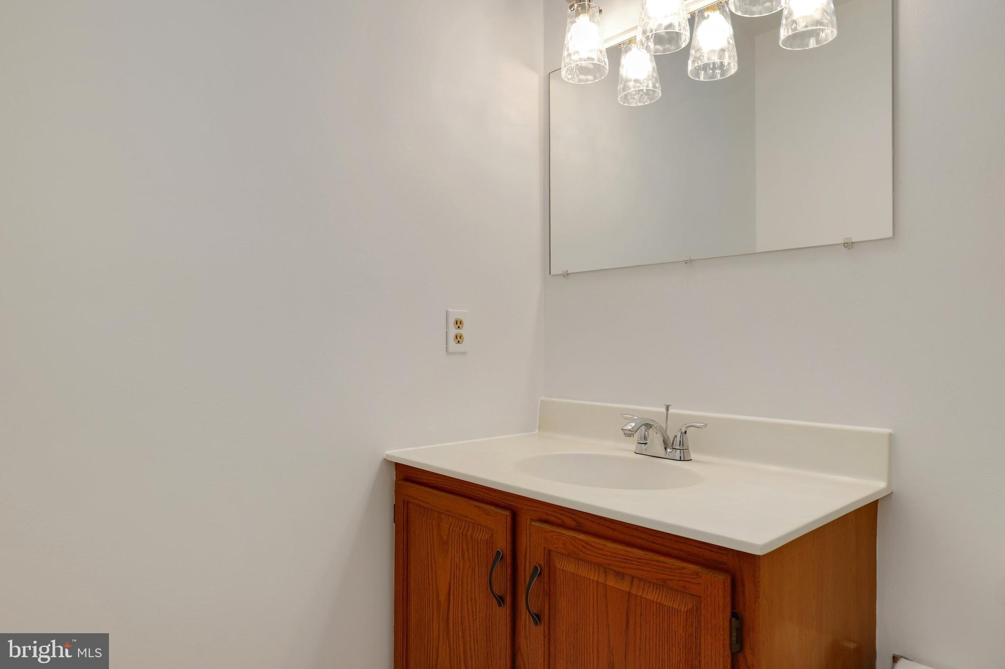 5652 Sandy Court Frederick, MD 21703 - Photo 16 of 35 a bathroom with a sink vanity and a mirror