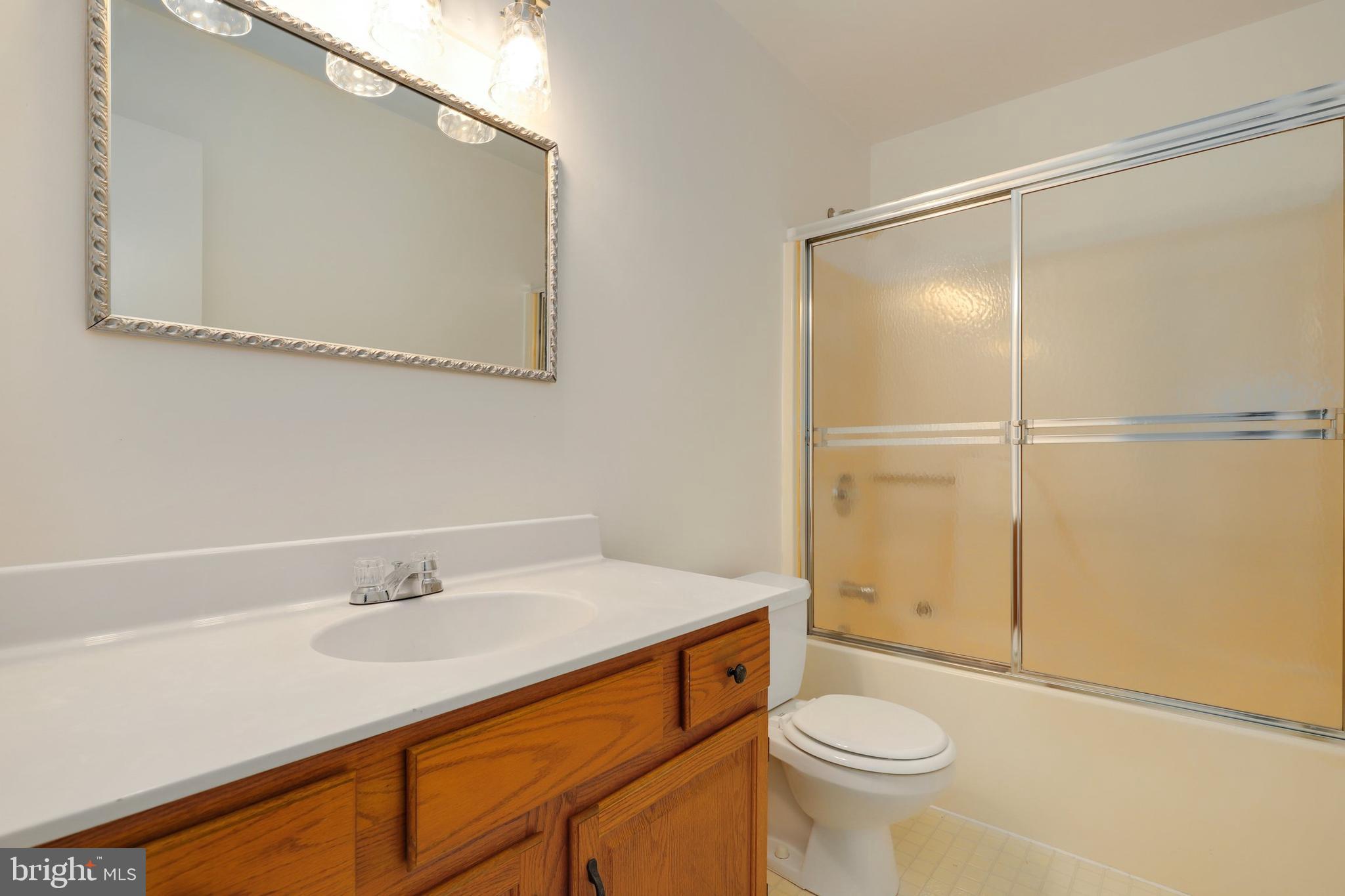 5652 Sandy Court Frederick, MD 21703 - Photo 20 of 35 a bathroom with a sink a toilet and shower