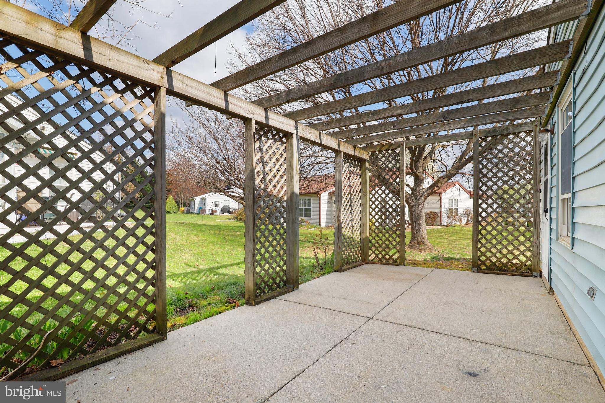 5652 Sandy Court Frederick, MD 21703 - Photo 23 of 35 a view of a pathway of a building with wooden fence