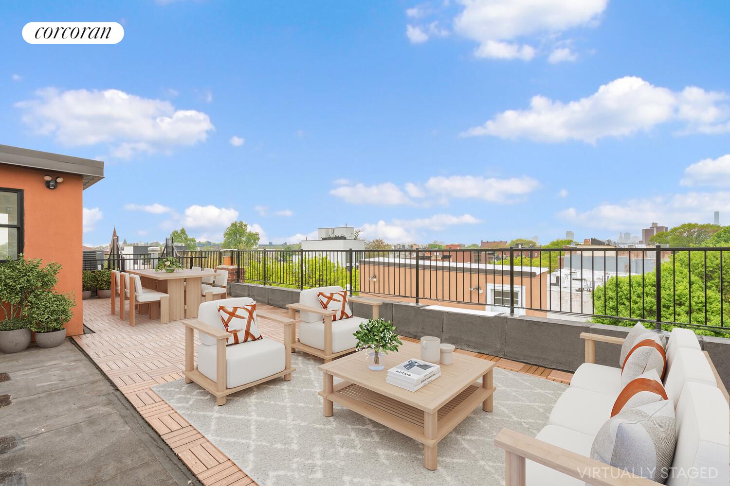 a living room with patio furniture and a potted plant
