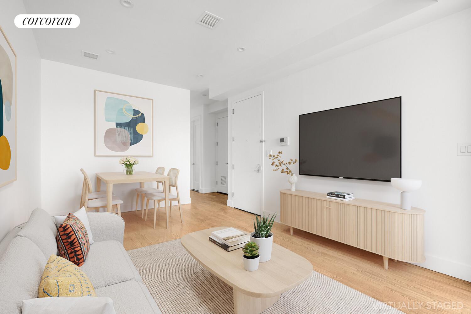 935 Lafayette Avenue, Unit 2 Brooklyn, NY 11221 - Photo 2 of 10 a living room with furniture and a flat screen tv