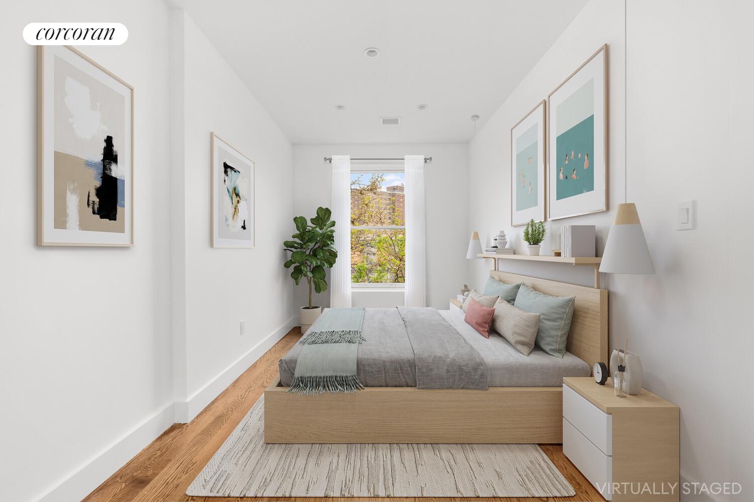 935 Lafayette Avenue, Unit 2 Brooklyn, NY 11221 - Photo 3 of 10 a bedroom with a large bed and a couch