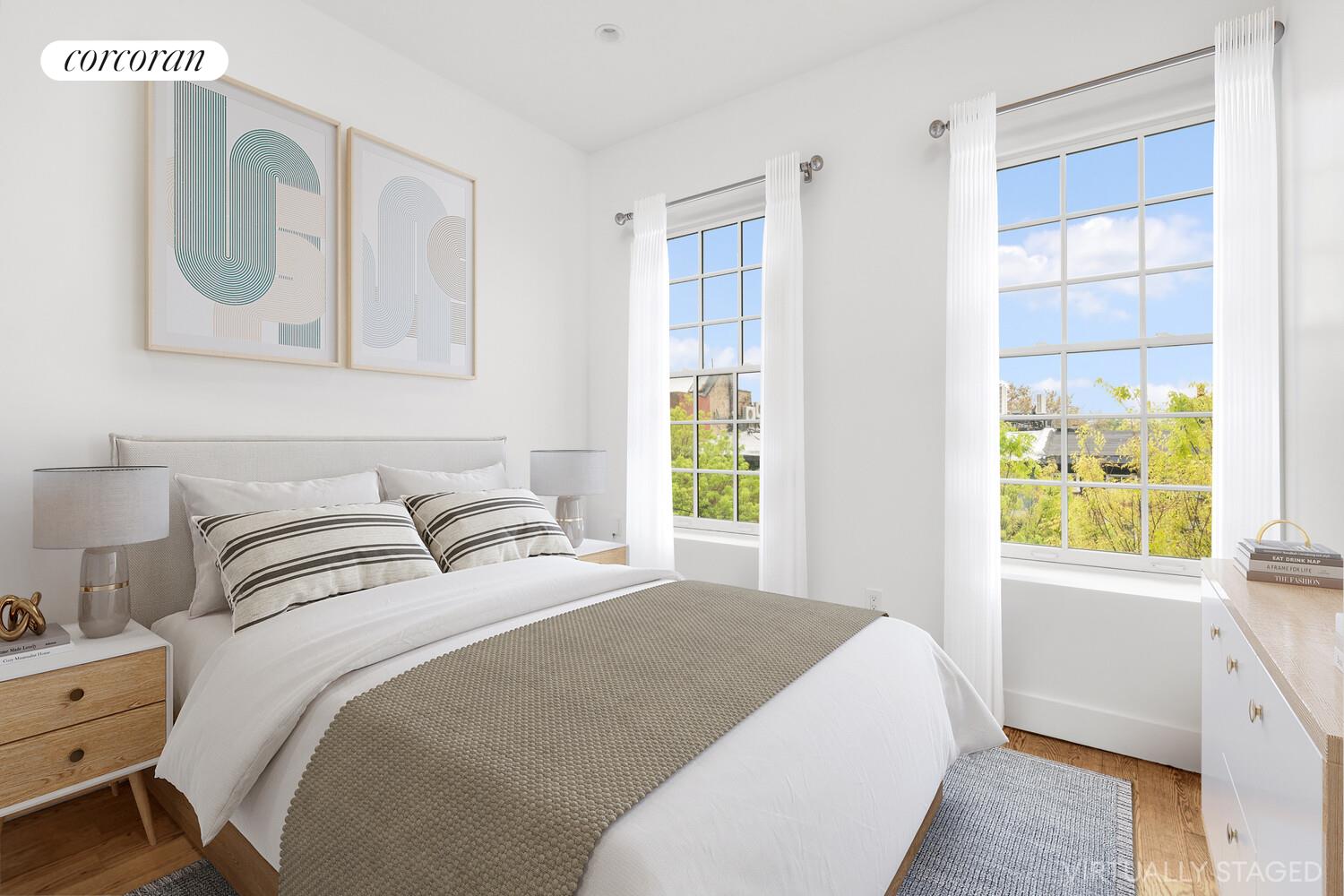 935 Lafayette Avenue, Unit 2 Brooklyn, NY 11221 - Photo 4 of 10 a bedroom with a bed a mirror and a window