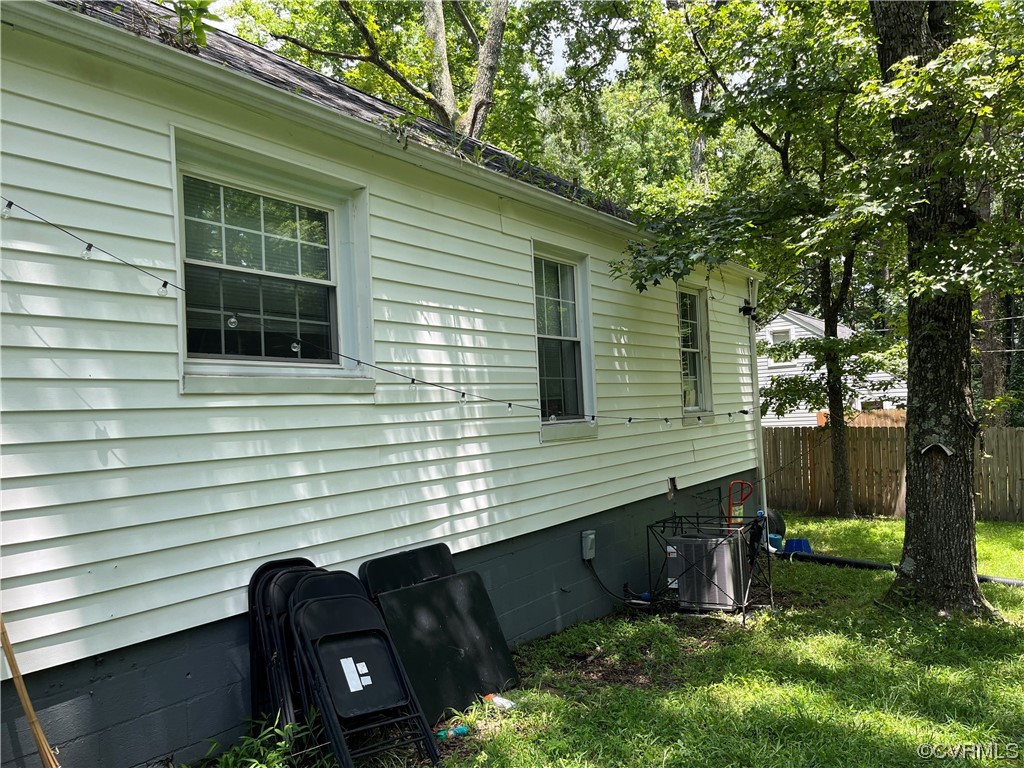 2909 Springview Drive Richmond, VA 23234 - Photo 2 of 4 a view of a backyard with chairs and a large tree