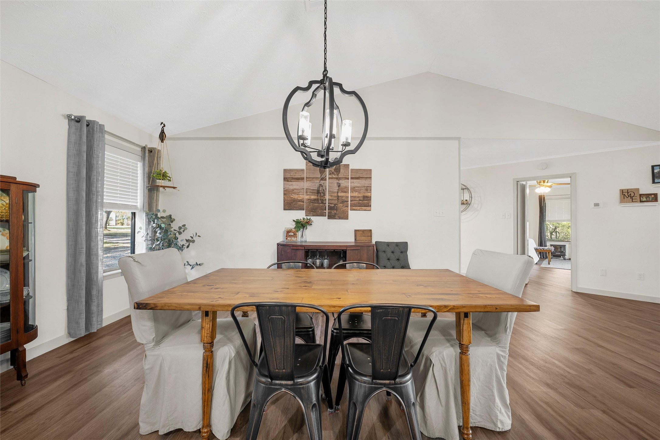 1330 State Highway Kosse, TX 76653 - Photo 22 of 39 a view of a dining room with furniture a chandelier and wooden floor