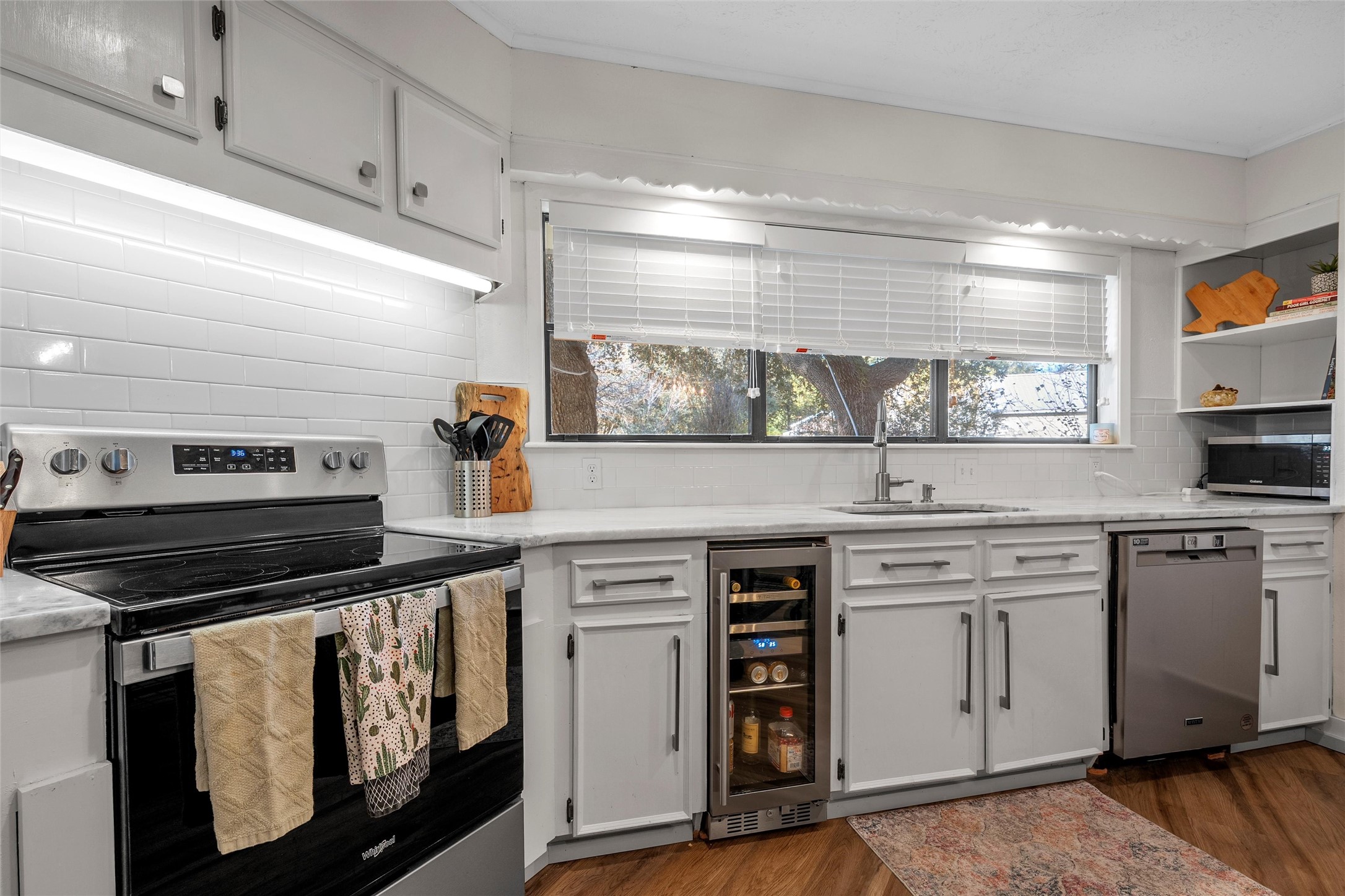 1330 State Highway Kosse, TX 76653 - Photo 28 of 39 a kitchen with white cabinets and appliances