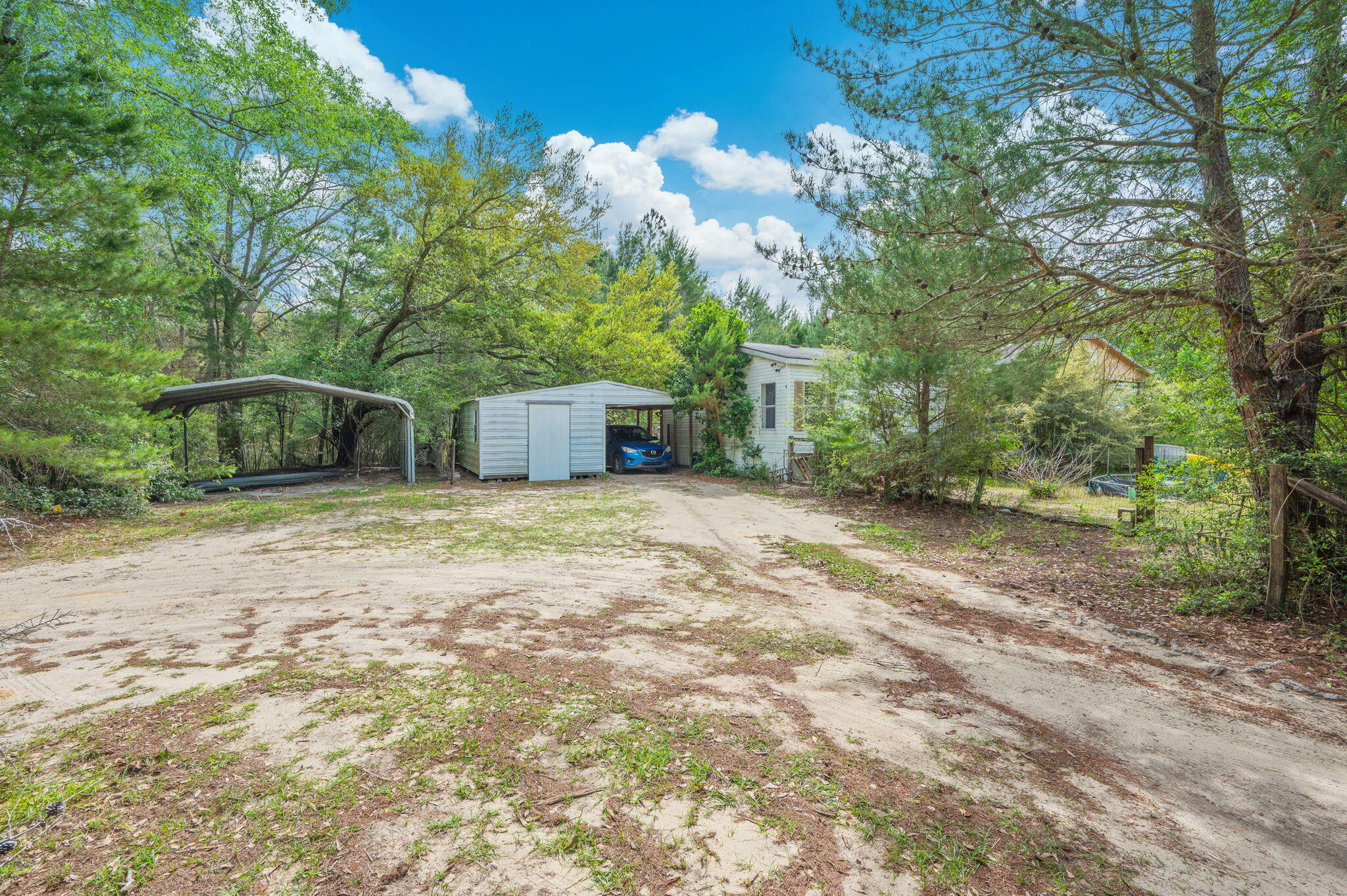 7765 Highway 331 DeFuniak Springs, FL 32435 - Photo 12 of 18 a front view of a house with garden