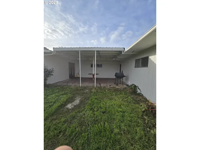 a backyard of a house with lots of green space