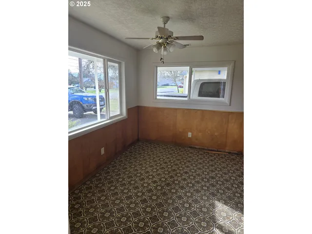 a large kitchen with sink and cabinets