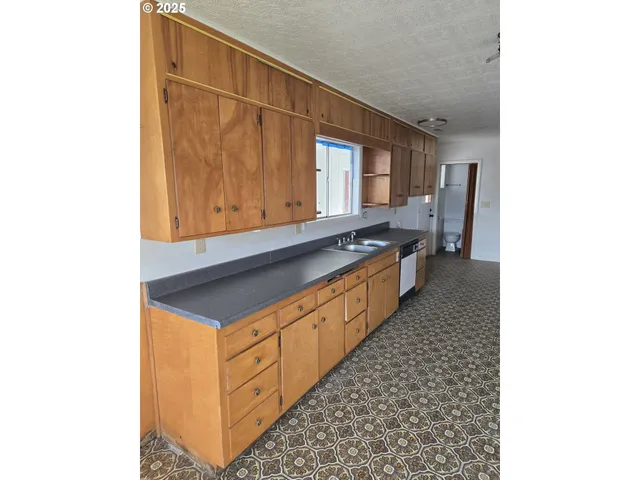 a hallway with cabinets
