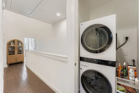 a view of a hallway with washer and dryer