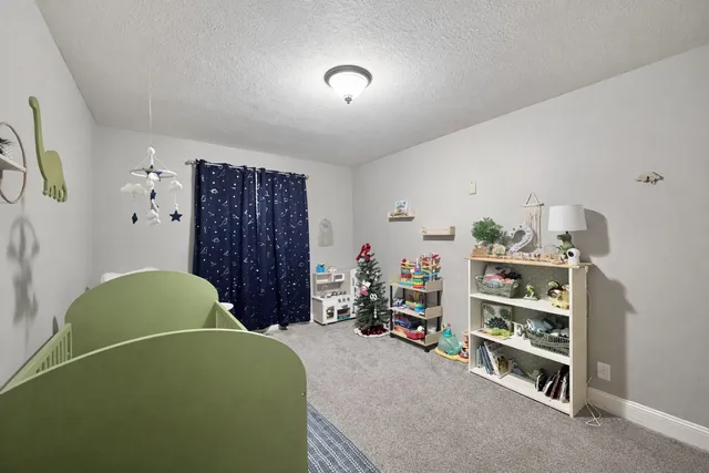 a bedroom with a bed and a closet