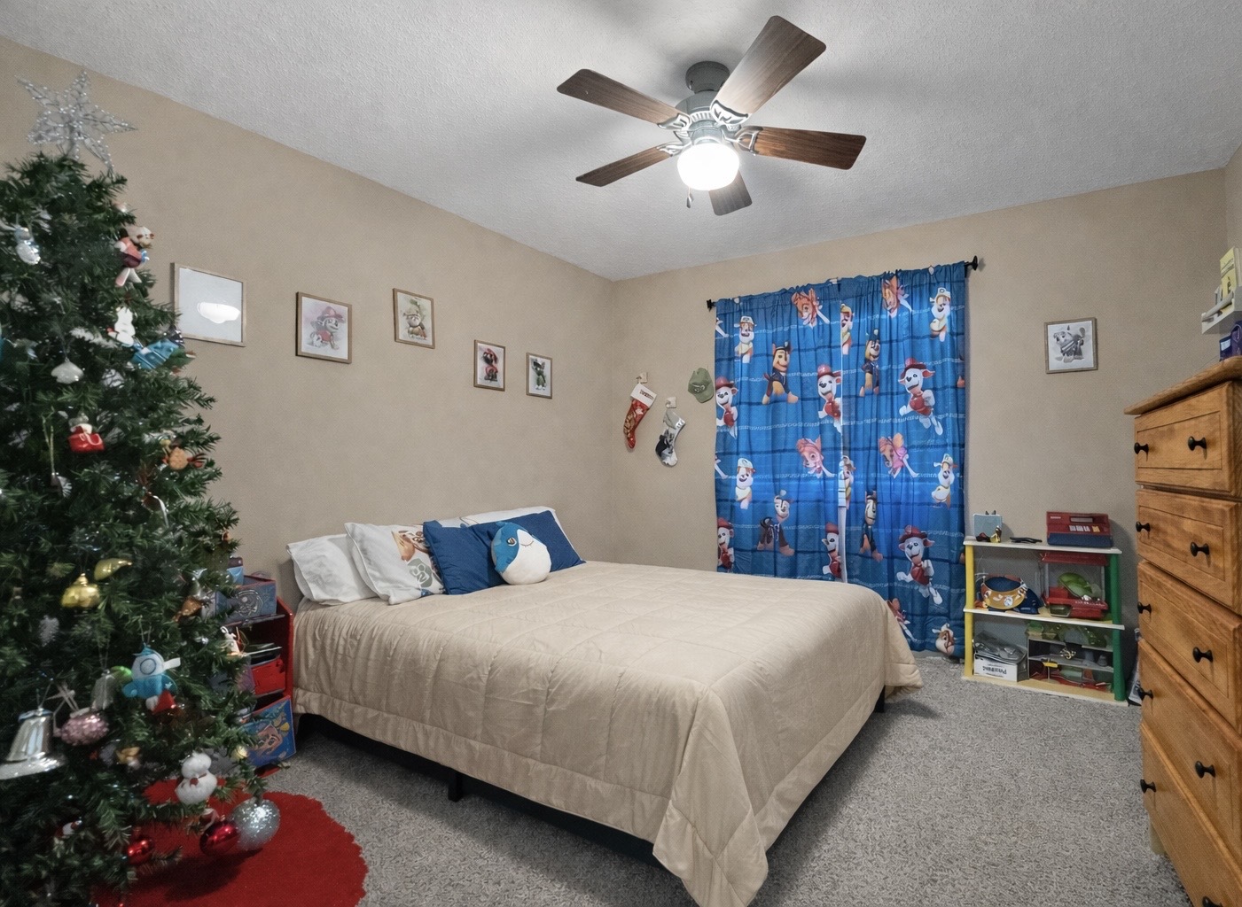 502 Kenneth Drive Heyworth, IL 61745 - Photo 13 of 18 a bedroom with a bed window and a chandelier